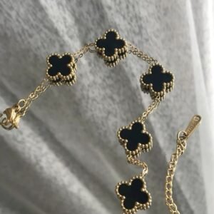 Elegant Gold-Tone & Black Clover Bracelet